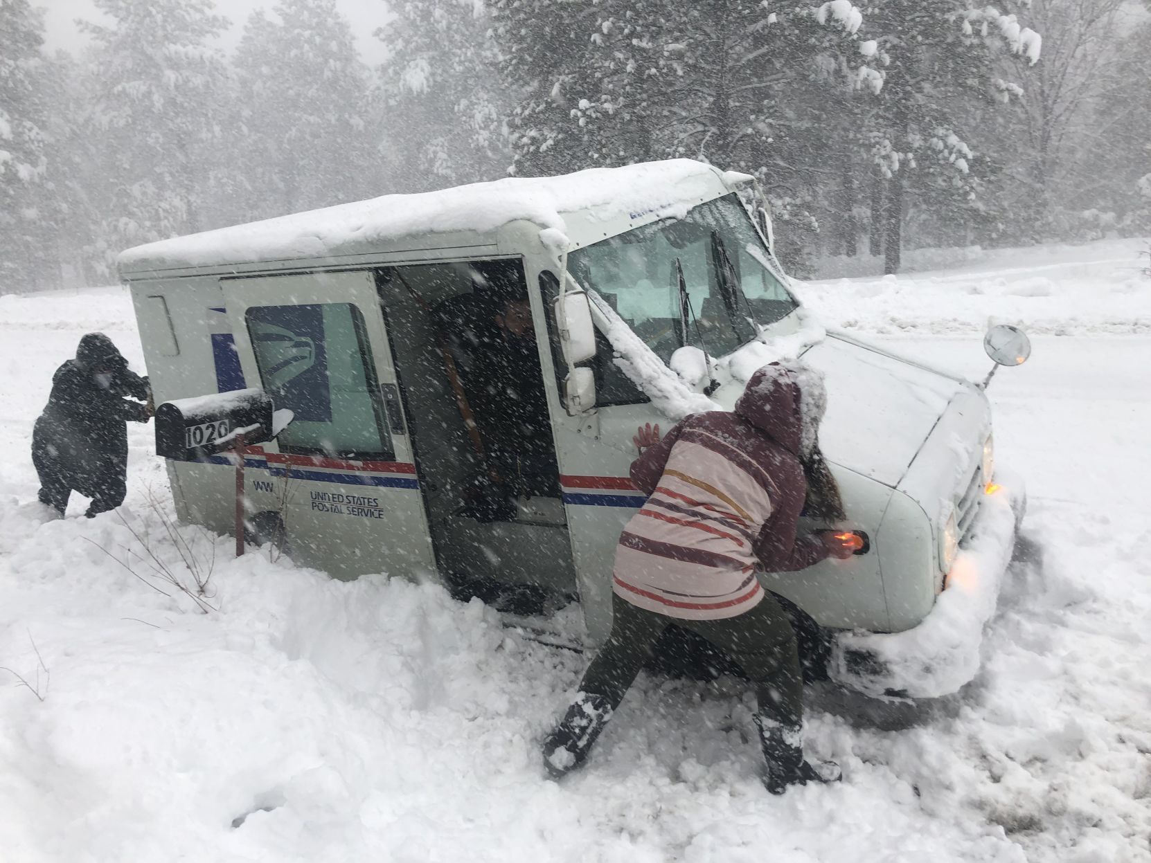 Postal Truck stuck in snow